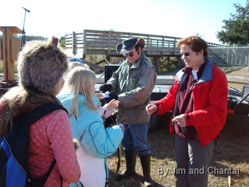  Signing autographs for youngsters, Operation Migration interns Geoff Tarbox and Trish Gallagher.
