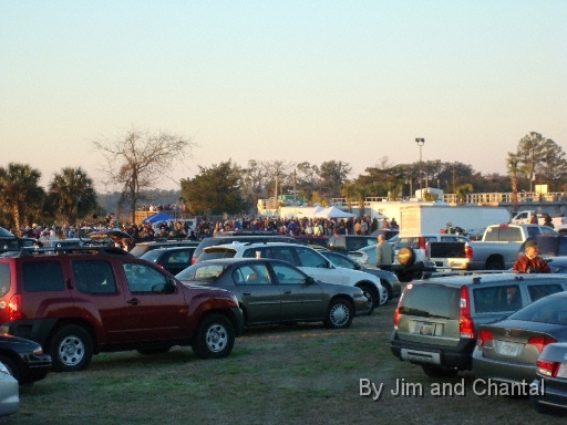  Excitement grows as sunrise warms crowd gathered near Operation Migration displays and trailers in town of St. Mark's.  OM's Liz Condie announces "cranes are on the way" from their overnight stopover in Jefferson County, Florida. Whooping Crane flyover, St. Mark's, Florida, January 17, 2009.