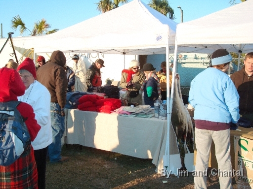  "Craniacs" stock up on gear from Operation Migration and the St. Mark's National Wildlife Refuge Association, to show support for Whooping Cranes and the dedicated people who help them.  Hot coffee was an attraction on this cold morning. Whooping Crane flyover, St. Mark's, Florida, January 17, 2009.