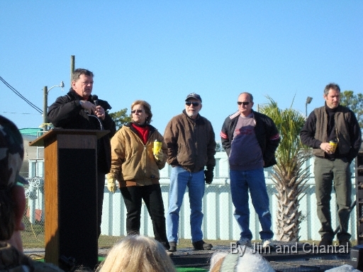  Operation Migration team in question-and-answer session with visitors, after leading 7 young Whooping Cranes to St. Mark's National Wildlife Refuge, north Florida.  L-R: pilot Joe Duff (CEO), Heather Ray (Development), top-cover pilot Don Lounsbury, Dale Richter (OM Board), and pilot Chris Gullikson.  Whooping Crane flyover, St. Mark's, Florida, January 17, 2009.