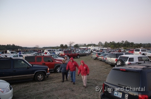  Chilled visitors crunch across frosty grass to their cars to warm up, awaiting arrival of Whooping Cranes.  Dawn temperature settles near 26F - - good for birds' flight, but frigid for pilots and viewers. Whooping Crane flyover, St. Mark's, Florida, January 17, 2009.