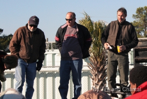  Operation Migration team members answer visitor questions during Whooping Crane arrival event in St. Mark's, north Florida.  L-R: Heather Ray (Development), pilot Don Lounsbury (Cessna top-cover), Dale Richter (OM Board), and ultralight aircraft pilot Chris Gullikson.   Whooping Crane flyover, St. Mark's, Florida, January 17, 2009.