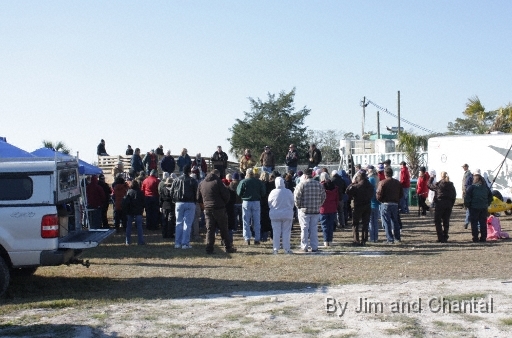  Joe Duff (at lectern), pilot and CEO of Operation Migration (OM) team, answers visitor questions at Whooping Crane event in village of St. Mark's.  OM team graciously met and greeted the public for several hours after leading 7 young Whooping Cranes to their winter home in St. Mark's National Wildlife Refuge, north Florida.  Whooping Crane flyover, St. Mark's, Florida, January 17, 2009.