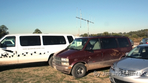  Operation Migration ground-support vehicles at St. Mark's Whooping Crane event.  The white personnel carrier and maroon tracking van travelled many times the 1113 migration-miles flown by the birds from Necedah, Wisconsin to St. Mark's, occasionally carrying young birds in crates when they could not complete a leg of the trip.  Whooping Crane flyover, St. Mark's, Florida, January 17, 2009.