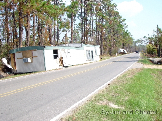  Damaged homes along road, southern Hancock Co., MS.