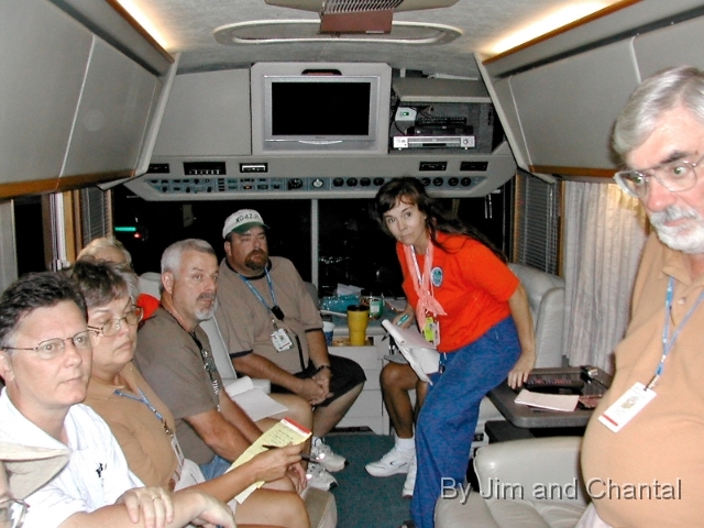  Florida amateur radio evening briefing 9-8-2005 fills RV   of Bill KI4JOG at EOC in Hancock Co., Miss.  L>R: George KU3O, Daisy KT4TW, Ricky KD4AST,   Don WU9T, Bill KG4ZJT, Mary KI4JOO, Ray K1HG.    Six Tallahassee area hams stood behind photographer.