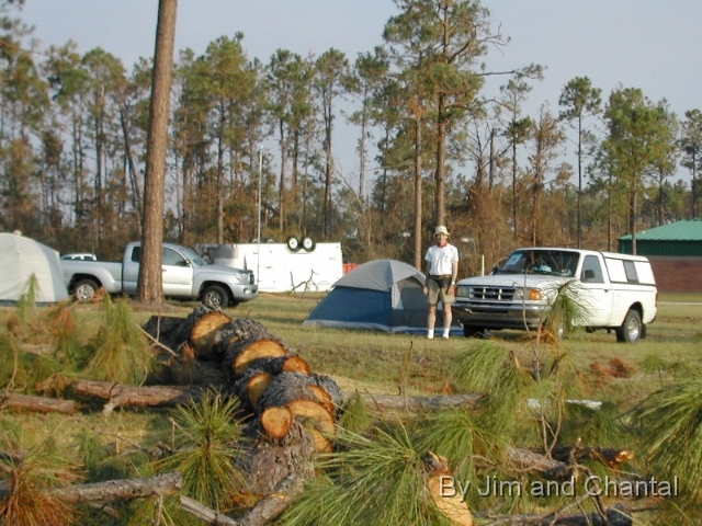  Campsite behind Emergency Operations Center (EOC) at   Hancock Co. Mississippi Vo-Tech school.   Note Hurricane Katrina damage to trees and trailer.