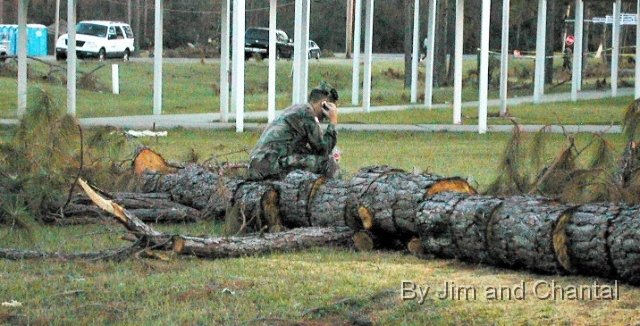  National Guardsman phones home amidst Katrina damage   at Hancock Co., Miss. Emergency Operations Center.   Radio replaced cell and land lines during early   stages of recovery from Hurricane Katrina.